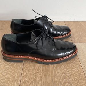 Stuart Weitzman black patent leather oxfords in size 37.